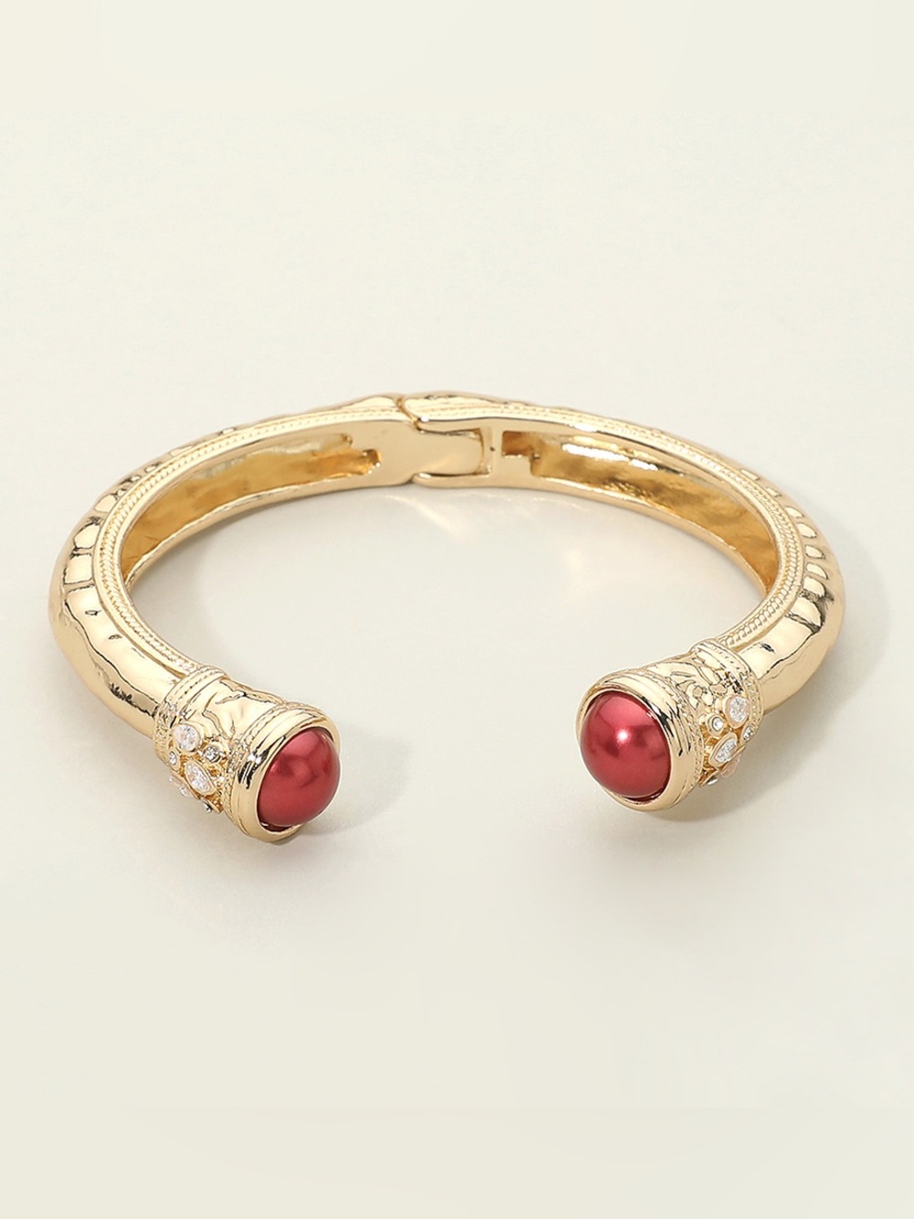 Elegant Gold Cuff Bracelet with Red Cabochon Accents